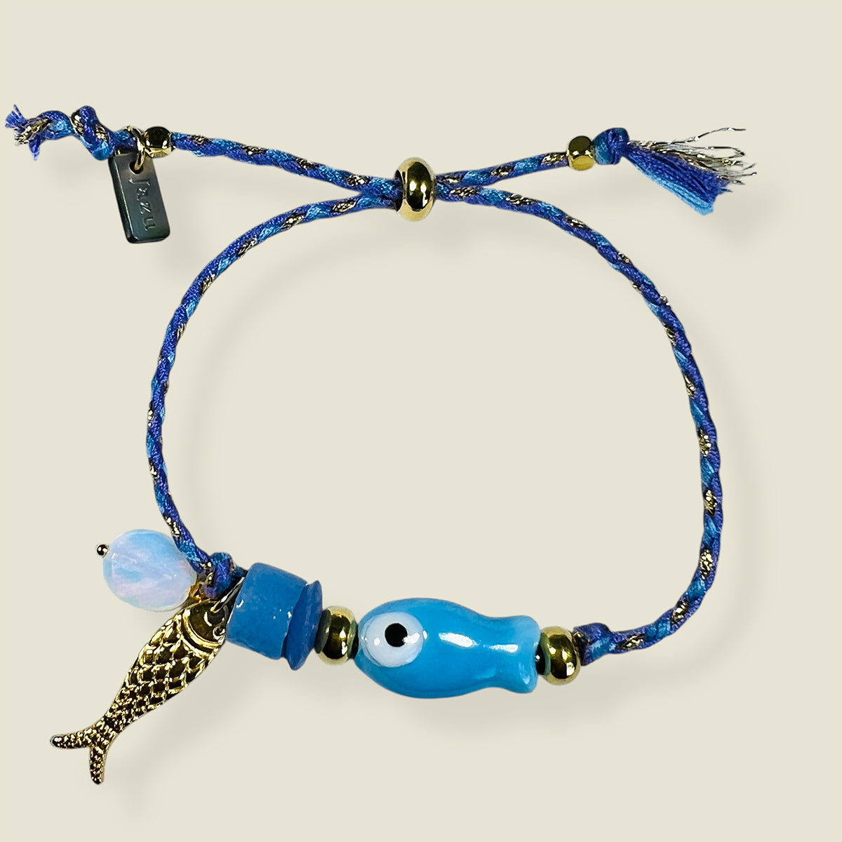 Unieke, handgemaakte armbandjes met keramiek visje