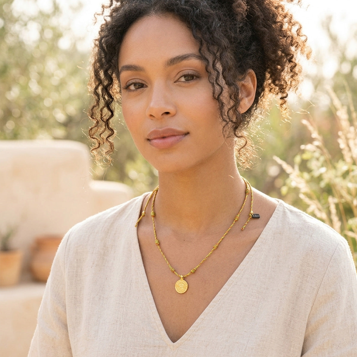 Touw ketting met gouden bedel