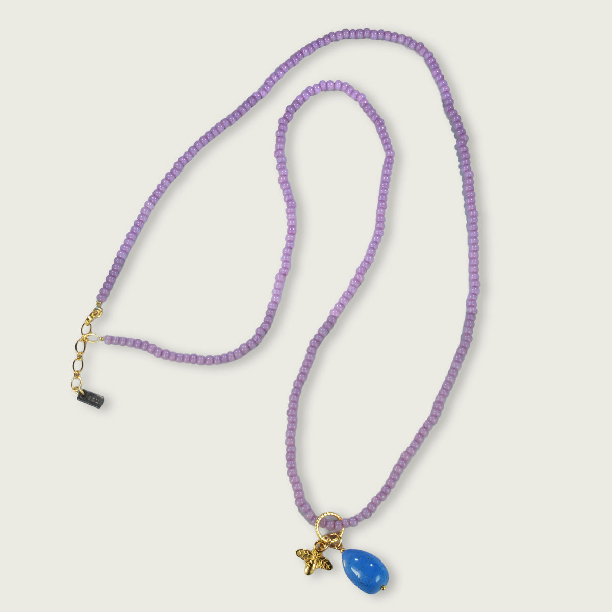 Lange ketting met 2 charms